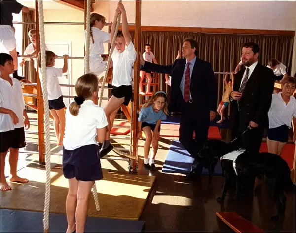 Tony Blair PM and David Blunkett Education Secretary watch a class in the gymnasium at St