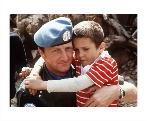 Irish UN Troops Lebanon a soldier hugs an orphan while on duty with the United Nations