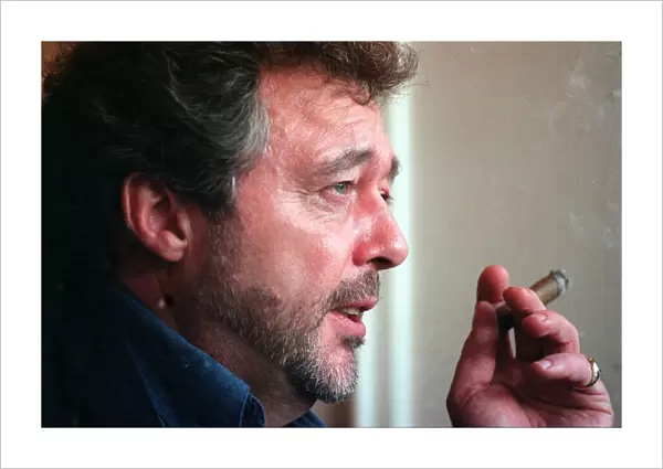 Entertainer Jeremy Beadle seen here smoking a cigar November 1997