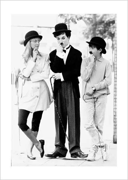 Twiggy model and actress with wax work of Charlie Chaplin
