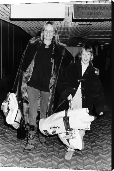 Twiggy Model Actress arriving at Heathrow Airport airport with daughter Carly