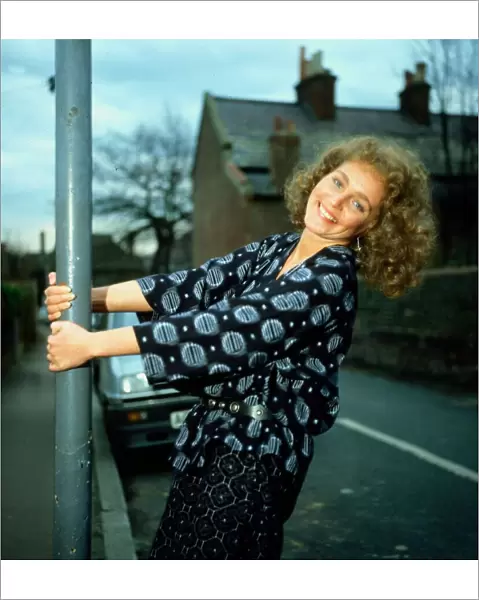 Gail Harrison holding onto lamp-post March 1983