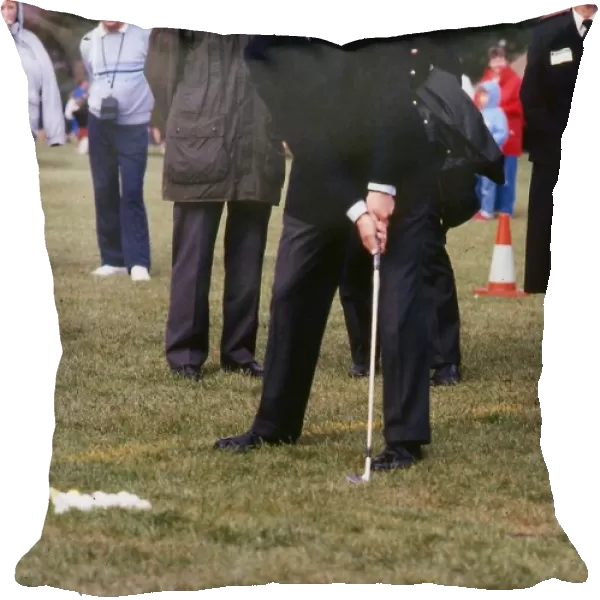 Prince Edward hitting golf balls in Stirling December 1989