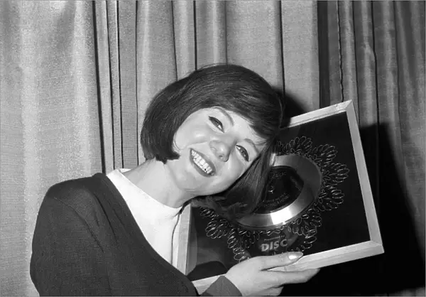 Cilla Black singer with her silver disc March 1964 for her record Anyone who