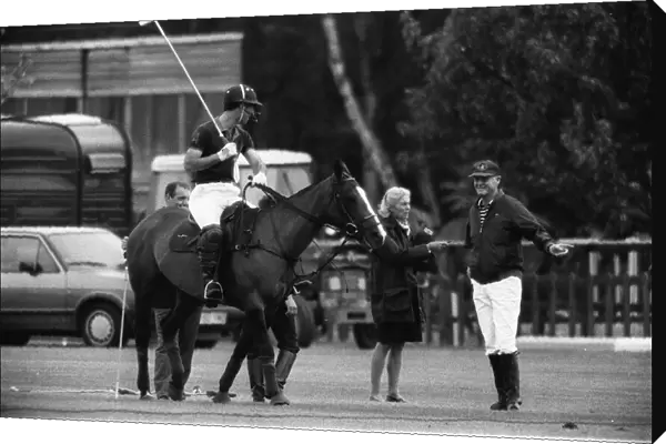 Prince Charles taking a few last pre match tips from his polo coach Major Ronald Ferguson