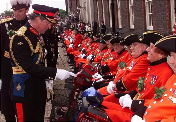 Prince Charles talks to Chelsea Pensioners in June 1999