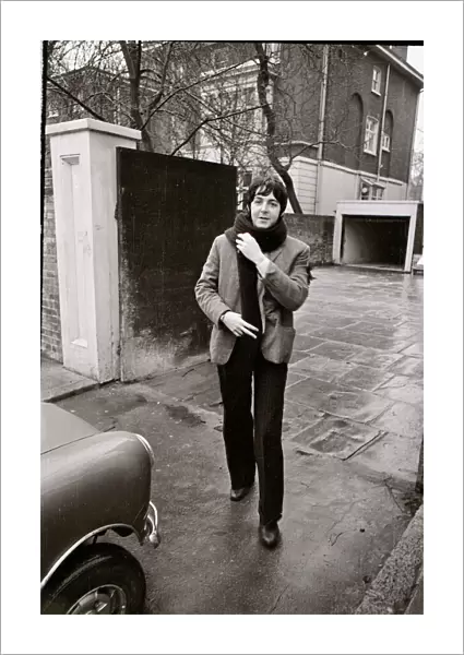 Paul McCartney of the Beatles about to get into his mini car December 1967