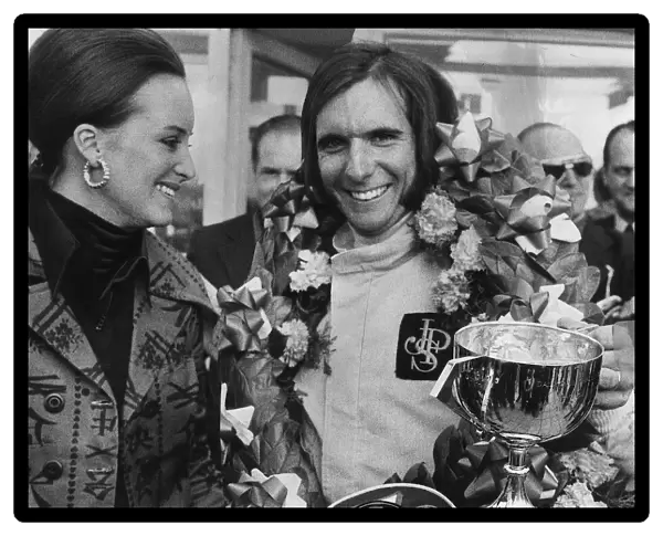 Emerson Fittipaldi wins the British Grand Prix at Brands Hatch stands with wife Marina