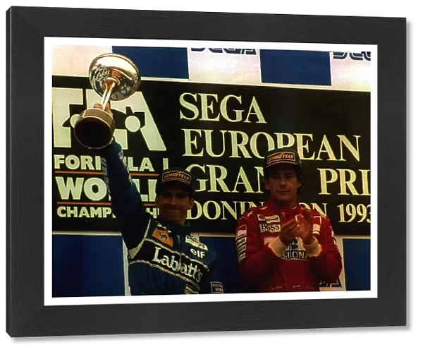 Damon Hill and Ayrton Senna on the winners podium take the applause as winners