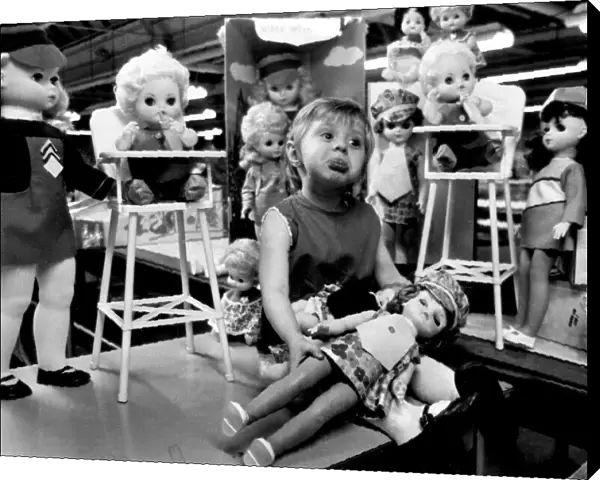 Kathleen Makeham with a selection of dolls at the end of the factory production line