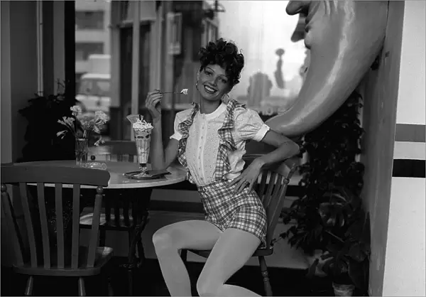 Fashion Shorts Seventies 1971 Model wearing short dungarees with tartan check
