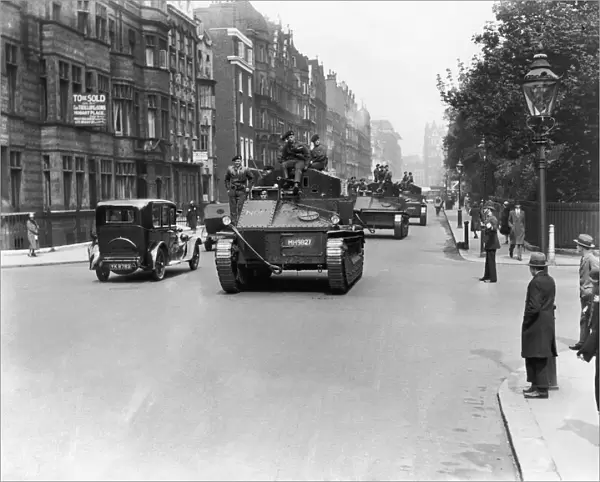 Soldiers seen here patrolling the streets of London in their Vickers Medium tanks