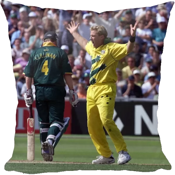 Shane Warne of Australia celebrates after taking the wicket Hansie Cronjie against South