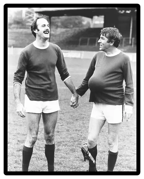 John Cleese Actor with fellow Actor Peter Cook at a Charity Football Match