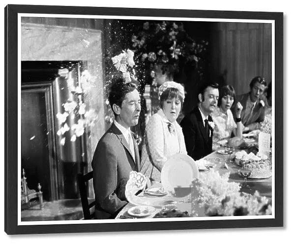 Filming Carry on Loving at Pinewood Studios. Kenneth Williams sitting