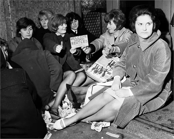Teenagers queuing in the rain at The Majestic Ballroom, Birkenhead for tickets to see The