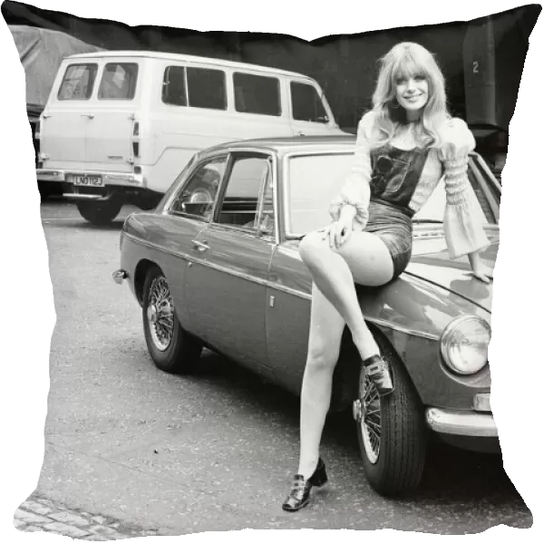Reveille model Emma Vincent seen here posing with a MGB GT which is top prize in