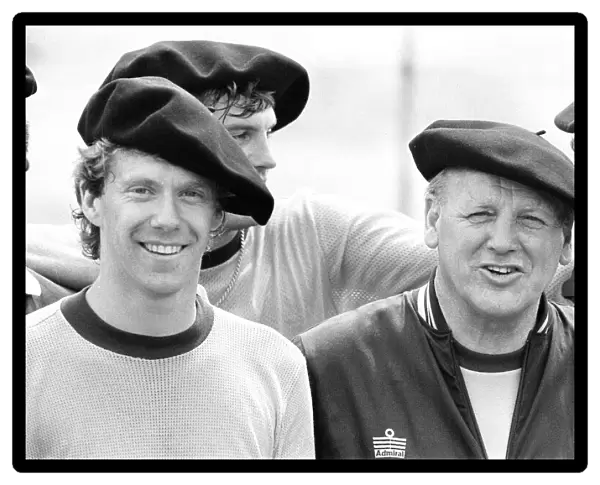 England footballer Tony Woodcock (left) and manager Ron Greenwood in relaxed mood wearing