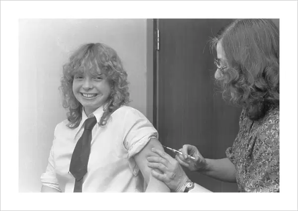 Marion Pollock, 15, subjects herself to an injection against German measles (Rubella