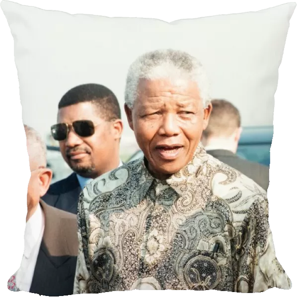 South African Preident Nelson Mandela seen here at Heathrow airport with Graca Machel