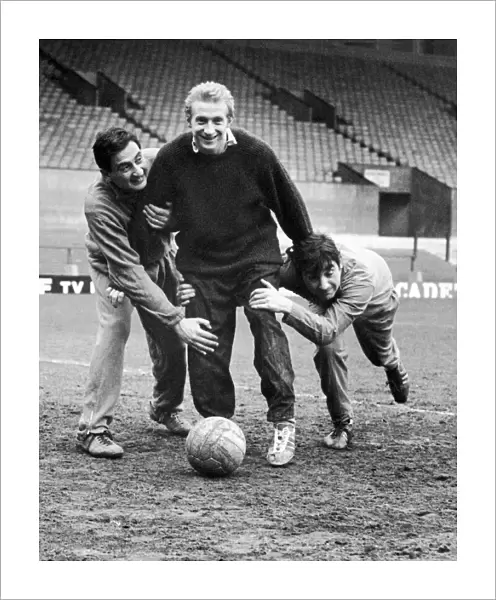 Denis Law of Manchester United training at Old Trafford with comedy double act Mike