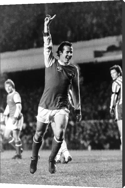 Liam Brady Arsenal Football Player celebrates after scoring goal. March 1980