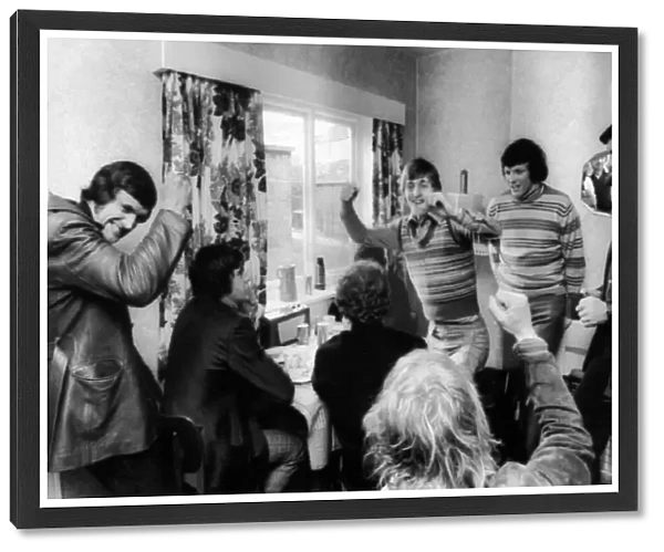 Leeds United players celebrate after hearing the FA Cup semi-final draw on the radio in a