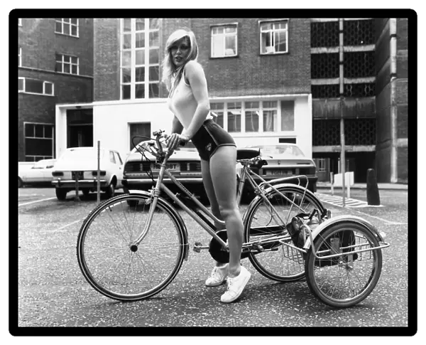Transport Cycles: Model Ann West (left) finds that three wheels are easier than two when