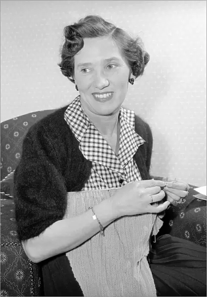 Woman at home knitting. Circa 1955 A119-003