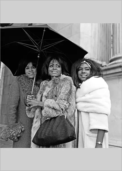 Tamla Motown Groups Invade London The Supremes share an umrella at Marble Arch