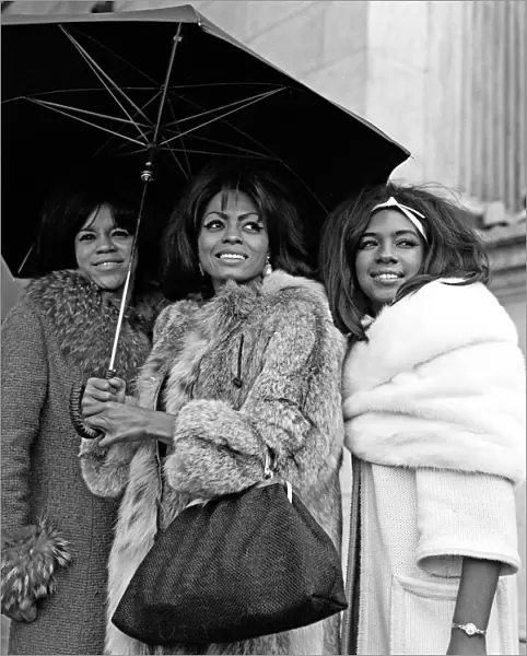 Tamla Motown Groups Invade London The Supremes share an umrella at Marble Arch