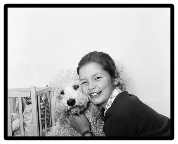 Child star Mandy Miller is pictured here at home on 8th May 1955
