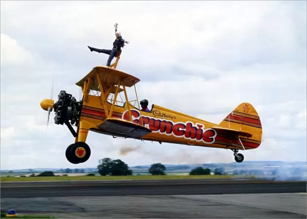 A Cadburys Crunchie Boeing-Stearman Model 75 biplane, with wing walker onboard