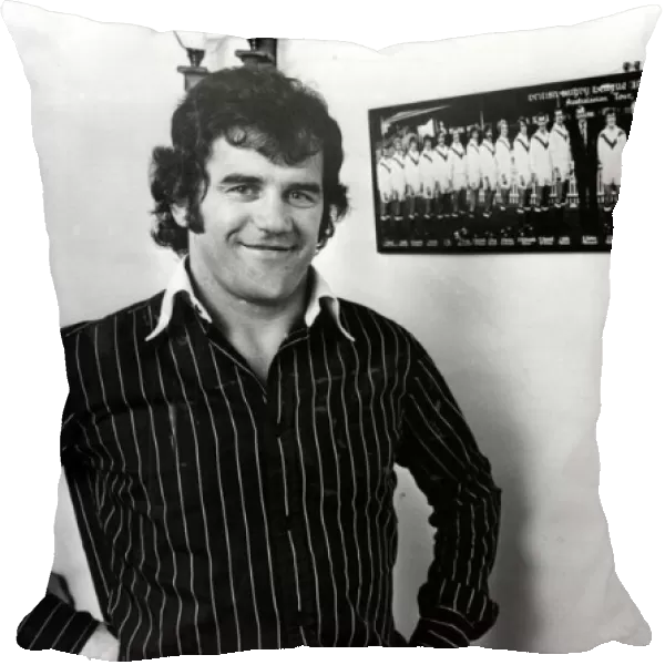 Former Newport and Wales international David Watkins pictured in front of a photo of