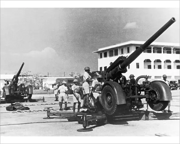 The Hong Kong and Singapore Royal Artillery (HKSRA) operating an anti-aircraft gun used