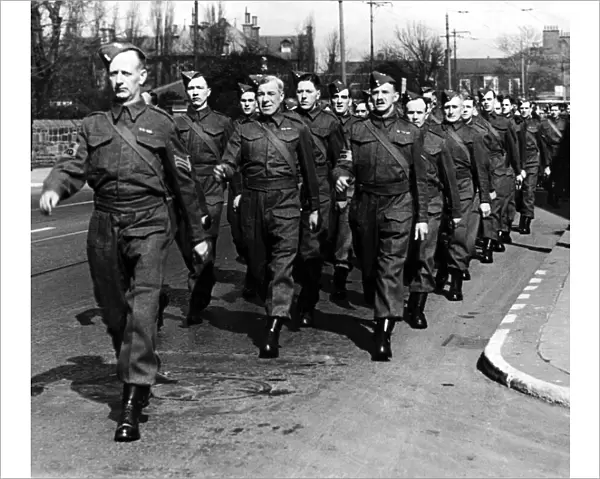 Gosforth Home Guard members marching to the Royalty Cinema to see a special film show