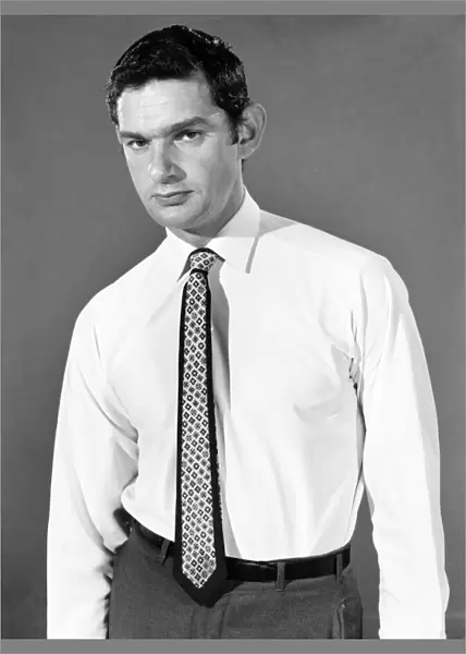 Clothing: Fashion: Menswear: Man wearing shirt and tie. Model: Mike Lester