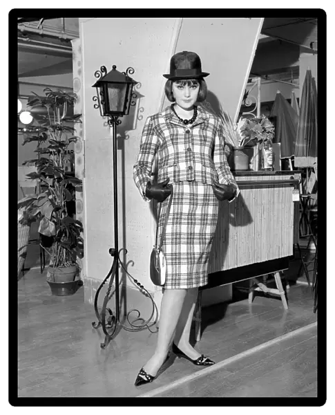 Clothing: Fashion: Paris: Woman modelling the latest 1963 French clothes designs in Paris