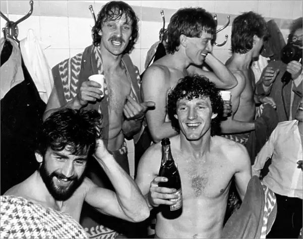 Champagne for the Villa players in the Arsenal dressing room after learning that they had