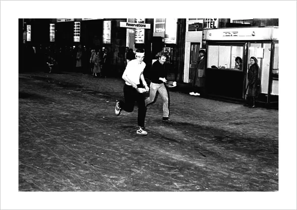 A pancake race at Newcastle Central Station on 15th February 1983
