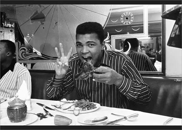 Cassius Clay (Muhammad Ali) eating stake at Isows restaurant in Soho Brewer Street London