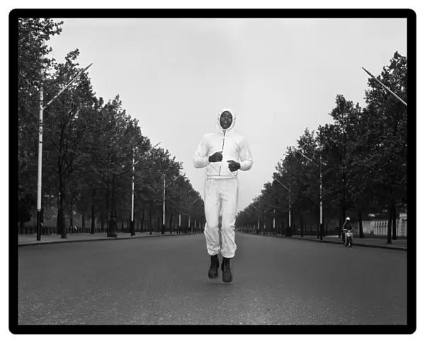 Cassius Clay aka (Muhammad Ali) running in The Mall London ahead of his first fight with