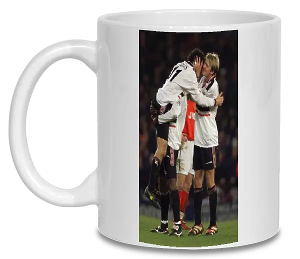 Manchester United winger David Beckham kisses team mate Ryan Giggs after scored in