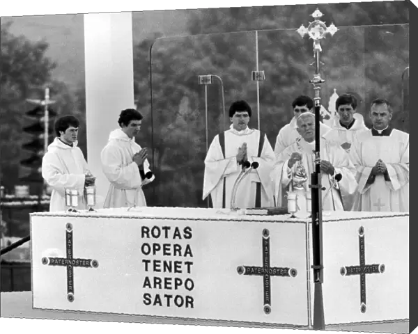 Pope John Paul II assisted by priests, leads the Mass at Heaton Park, Manchester