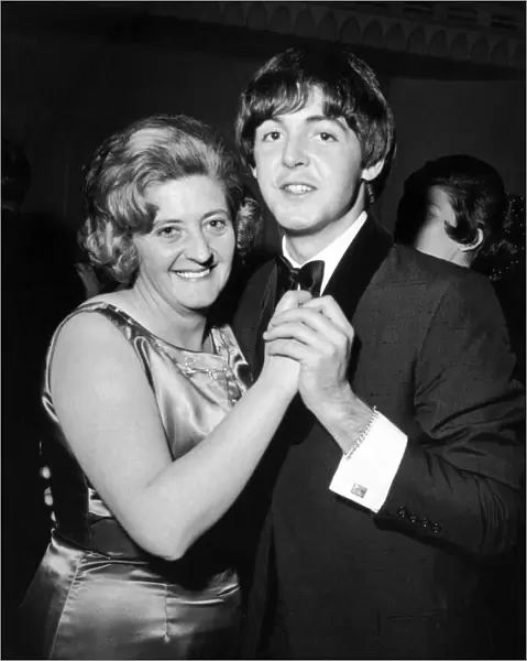 Paul McCartney and his Aunt Joan enjoy a dance at reception held at The Dorchester Hotel