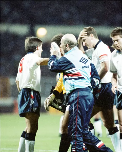 England v Brazil 28th March 1990, Wembley. Peter Shilton is led from the field by physio