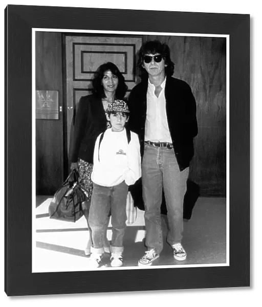 George Harrison formerly of the Beatles with family at London Airport August 1989