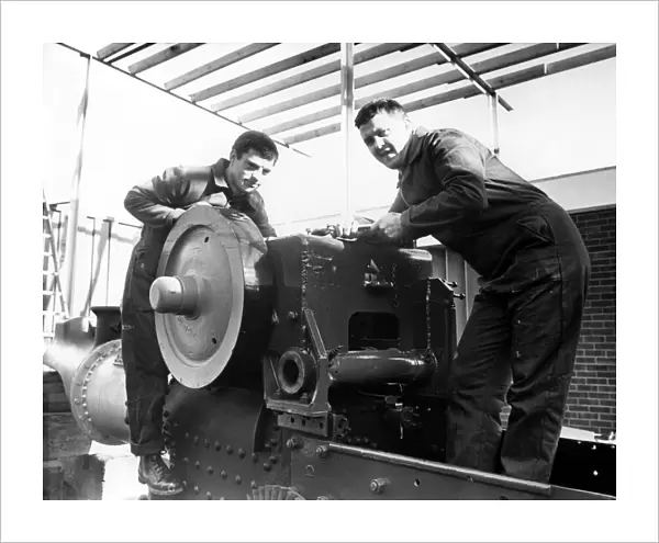 A vintage 1947 steam roller being restored by Joe Shiel, left