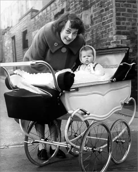 Mrs L jackson, of Cross Parade, with Susan in a pram which cost 5 on 23rd March 1961