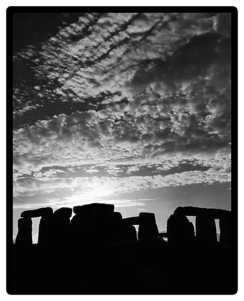 Sunset over Stonehenge in Wiltshire Britain Sunset Silhouette Clouds Druids Country Scene